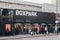 People walking past the shops at BOXPARK mall in Shoreditch, London, UK