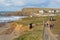 People walking on the path from Bude North Cornwall to nearby beach of Crooklets England UK