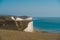 People walking the paths of the Seven Sisters, Clifftop Paths Nature Reserve View of the Chalk Cliffs and the English Channel sea