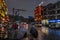 People walking in rain in Wulingyuan town at night