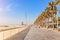 People walking in the seafront of La Barceloneta at early morning. High season concept