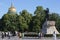 People walking on Senate Square by the Bronze Horseman equestrian statue of Peter the Great. St. Isaac`s Cathedral