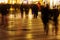 People walking in a shopping street in motion blur at night