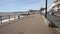 People walking Sidmouth promenade seafront Devon with sound