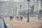 People walking in the snow in the center of the city on a winter day