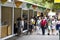 People walking and stopping to buy in a fair of crafts and typical products of Galicia in the park of the city center