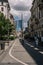 People are walking on the street against the Porta Nuova Garibaldi Towers in Milan, Italy