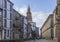 People walking in the street in the final destination of the pilgrimage Camino de Santiago de Compostela, Galicia, Spain.