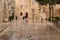 People walking on a street on a rainy day in Mdina