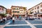 People walking by the streets of the famous Old Town of Sirmione city located on peninsula of Garda lake in Italy. Square full of