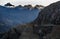 People walking on the terraces of Pumatallis, ancient Inca fortress and mountains covered in clouds, Sacred