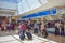 People walking to different terminals and top view of tickets and check-in blue sign at Orlando International Airport  4