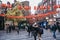 People walking under Chinese lanterns on the street in Chinatown, London, UK