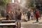 People walking under misting system to cool off during heatwave