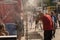 People walking under misting system to cool off during heatwave