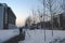 People walking on Unirii Boulevard between Bucharest Courthouse and the National Library building