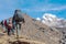 People walking up in Mountains with Backpacks