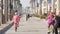 People walking, waterfront promenade beachfront boardwalk. Ocean beach near Los Angeles, California USA