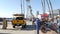 People walking, waterfront promenade, beachfront lifeguard. Ocean beach near Los Angeles, California