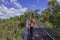 People walks on canopy walkway of Lotterywest Federation Walkway at King`s Park and Botanical Garden in Perth, Australia.