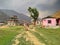 People walks on trodden paths on the grass in the village Manthali in Ramechhap District in Nepal