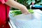 People washing vegetable by water.