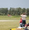 People watch Model Airplane Land