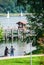 People watch sailboats on Lake Chiemsee