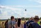 People are watching helicopter flying at Spilves Aviation Festival