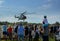 People are watching Mil Mi-17 helicopter taking off at Spilves Aviation Festival