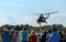 People are watching Mil Mi-17 helicopter taking off at Spilves Aviation Festival