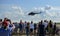 People are watching Mil Mi-17 helicopter taking off at Spilves Aviation Festival