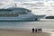 People waving farewell to The Radiance of the Seas ocean cruise liner