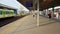 People wearing face masks wait for a train at Warszawa Stadion station during the coronavirus epidemic.