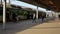 People wearing face masks wait for a train at Warszawa Stadion station during the coronavirus epidemic.