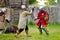 People wearing knight costumes during historical reenactment on annual Medieval Festival, held in Trakai Peninsular Castle