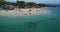 People and White Beach and Seashore in Moalboal, Cebu, Philippines. Beautiful Landscape with Seashore in Background III