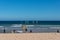 People windsurfing at the beach. Summer lifestyle scene