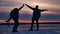 People winter aircraft silhouette photograph waving their arms in the sky joy snow sunlight. group of tourists walking