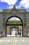 People wlaking through the second archway exiting Balboa Park, San Diego CA