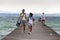 People on wooden pier on Lago di Garda in Sirmione, Italy