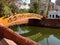 People on Woody Bridge on lake