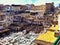 People work at the leather tanning in large courtyard in Fez