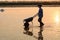 People work on salt fields in Hon Khoi, Khanh Hoa, Vietnam