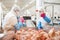 People working at a chicken factory, stock photo.Production line with packaging and cutting of meat.Meat processing equipment