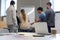 People working at Flip chart business items on Table