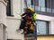 People working at a height. Industrial mountaineering, window washing and repair of building cladding on safety bindings