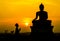People worship Buddha, Buddha statue on sunset sky background