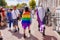 People wrapped up in lgbt pride flag and in asexual pride flag - lesbian, gay, bisexual, transgender, queer Pride Parade in