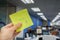 People with yearly bonus written on yellow sticky note in left hand
